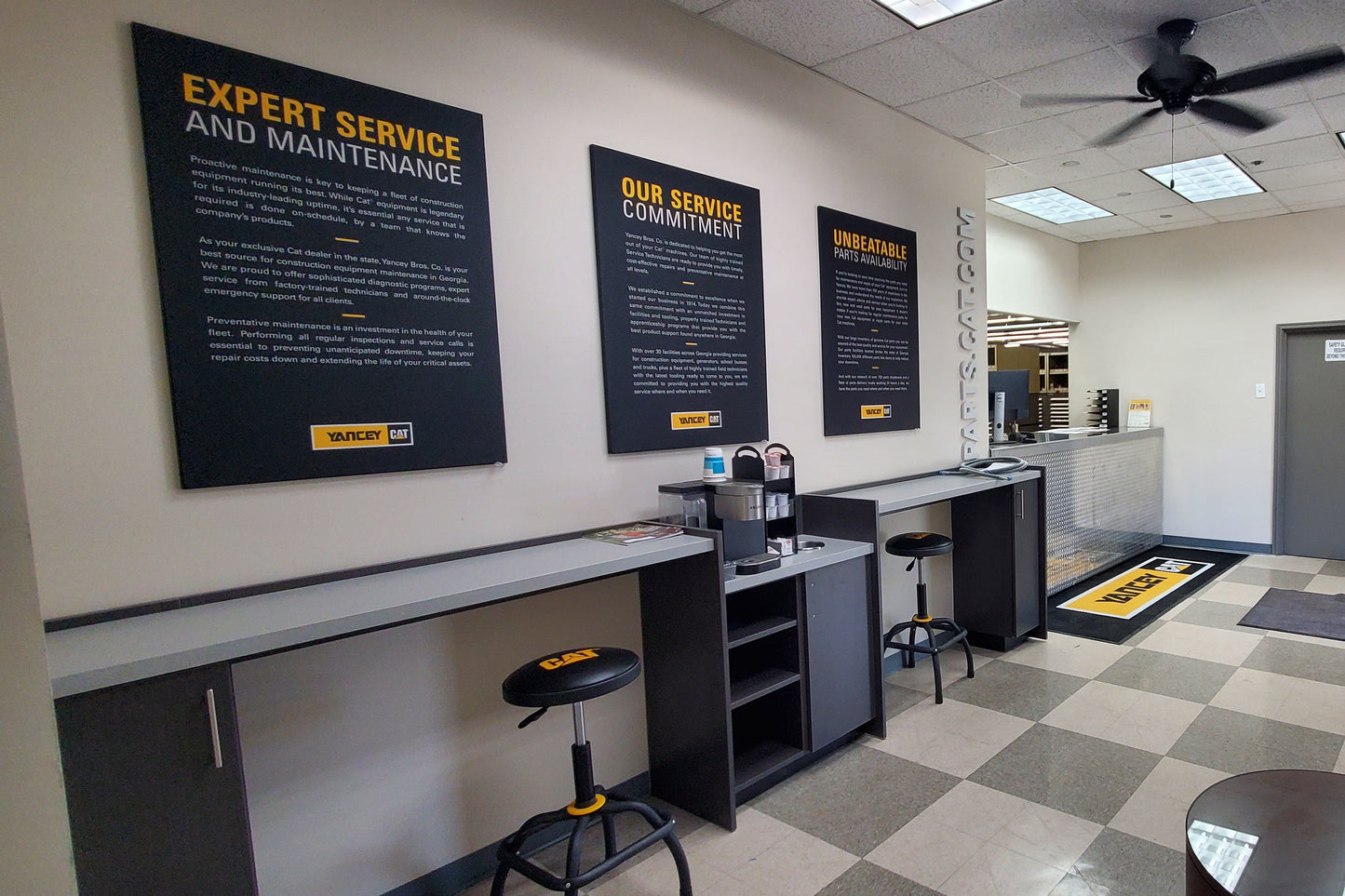 Modern kitchen interior with checkered ceiling and large blackboards on walls