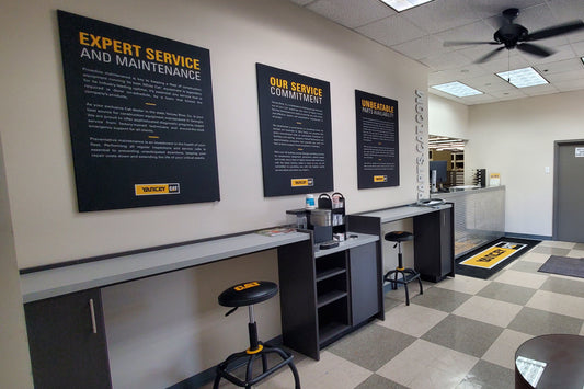 Modern kitchen interior with checkered ceiling and large blackboards on walls