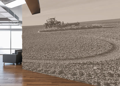 Modern office interior with a large wall mural of a tractor in a field.
