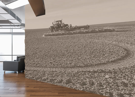 Modern office interior with a large wall mural of a tractor in a field.