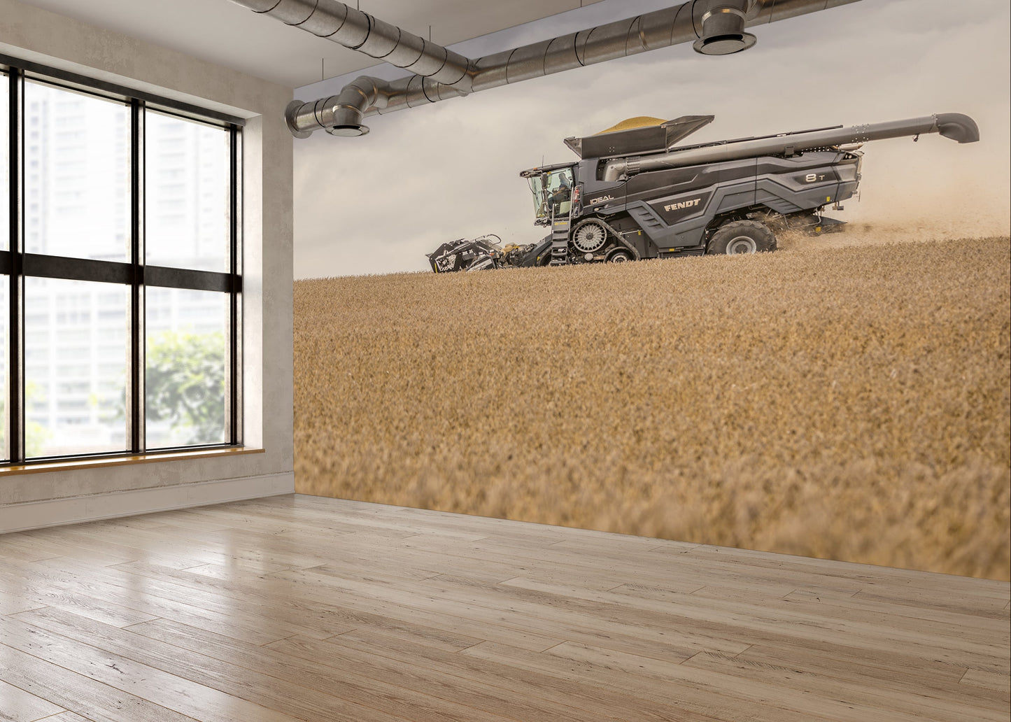 Room with large windows and a wall mural of a combine harvester in a field.
